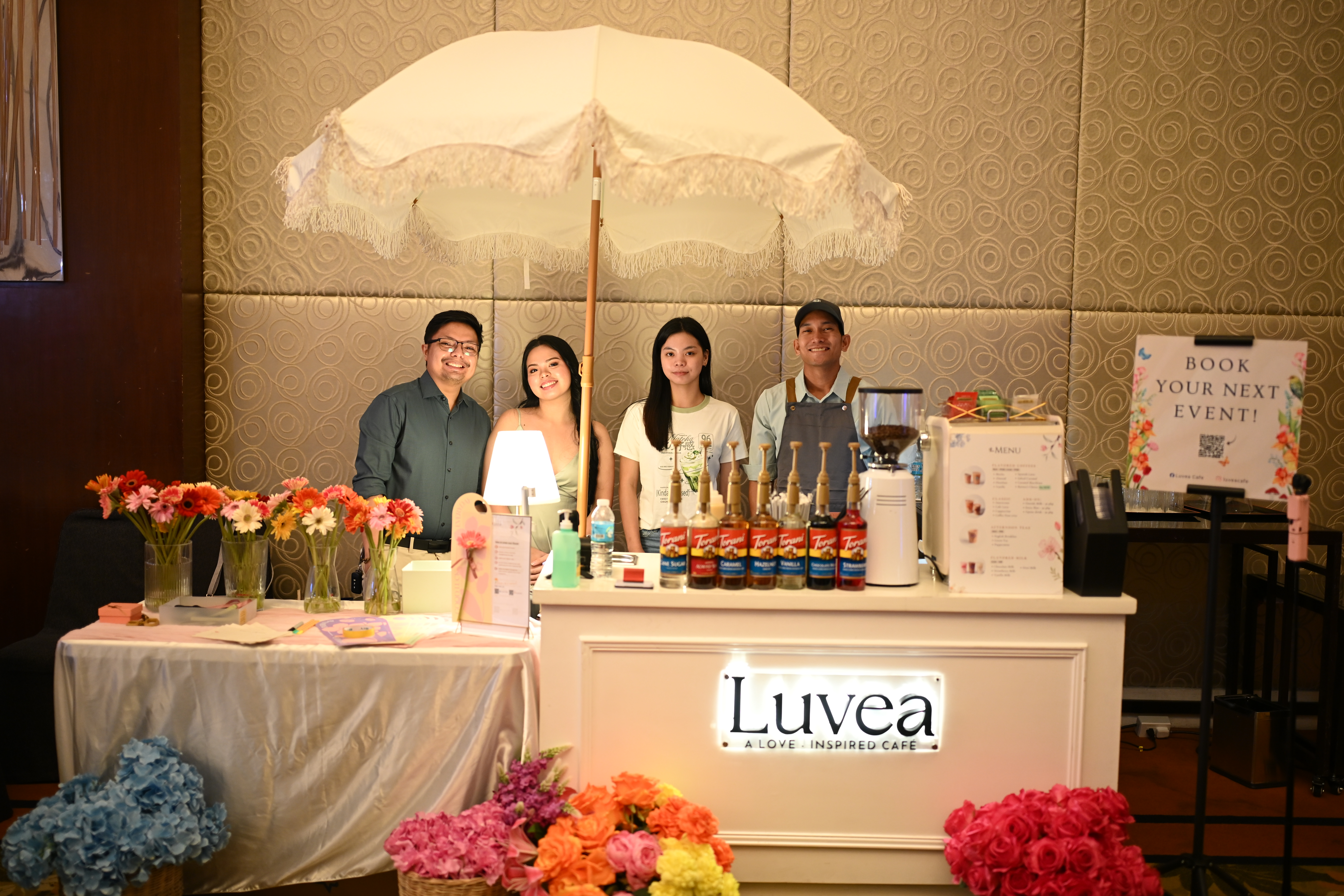 The Luvea team at a beautifully set up coffee and floral bar